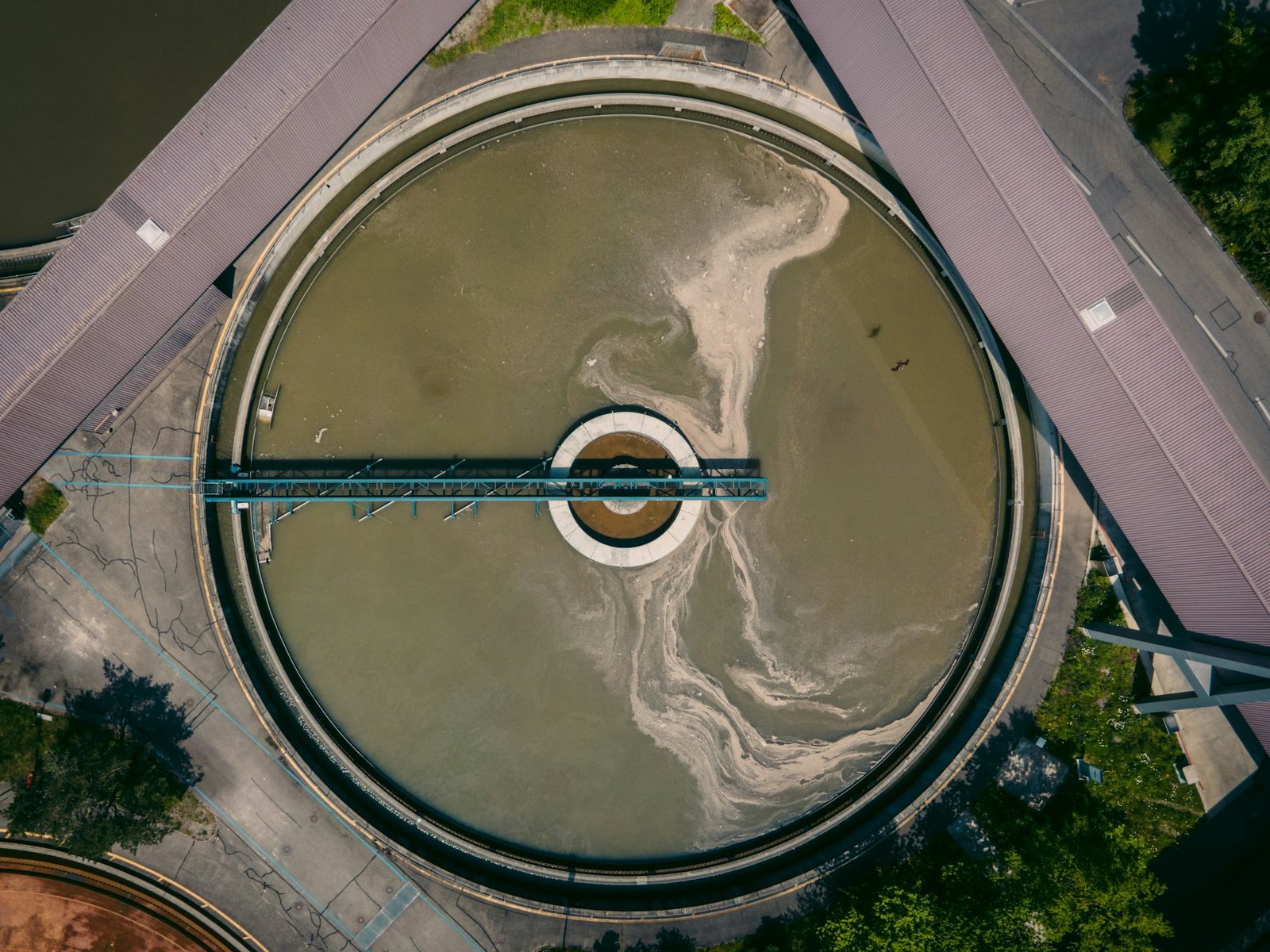 Top-down view of a circular clarifier at a biological wastewater treatment plant