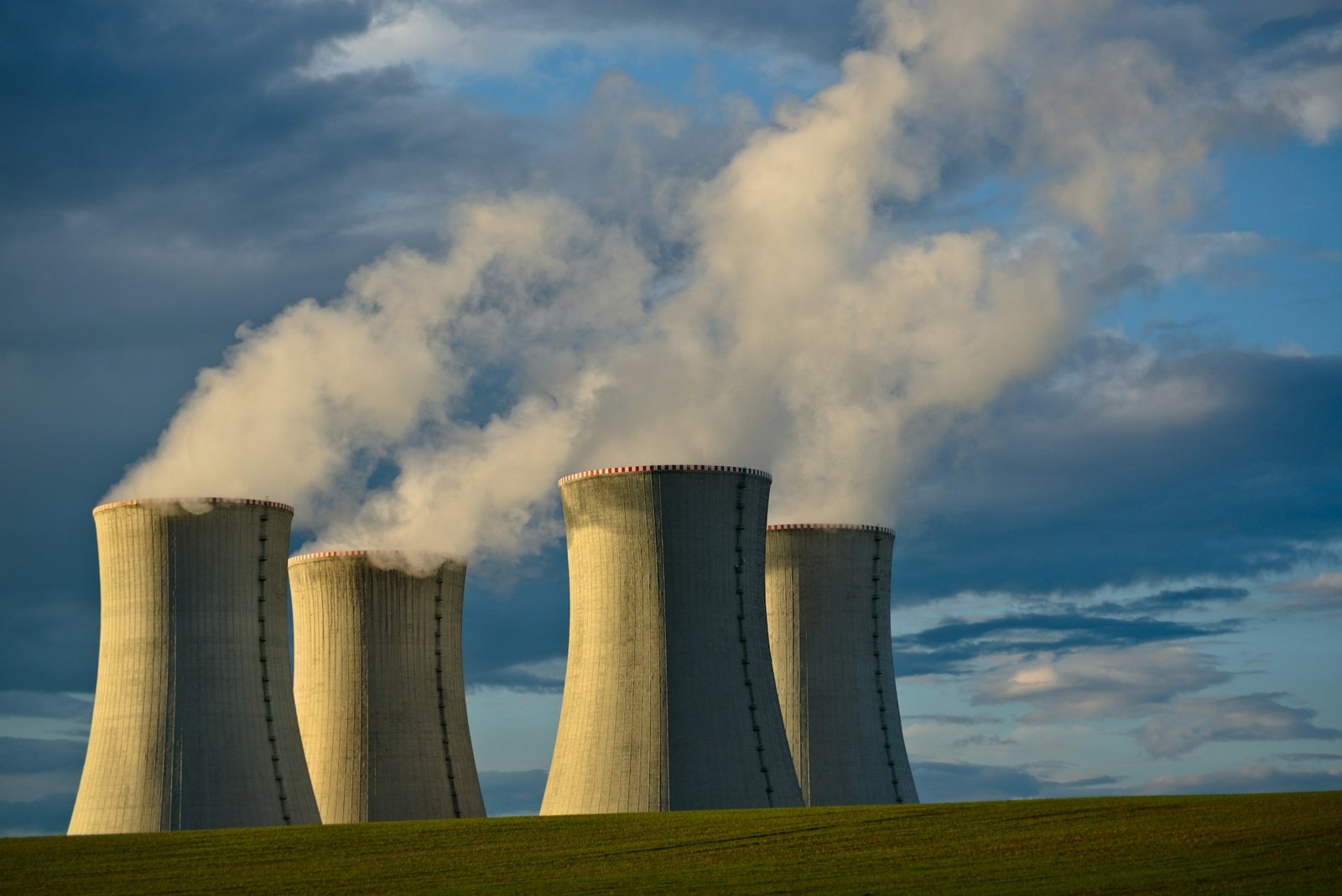 Cooling towers releasing steam at a power generation plant