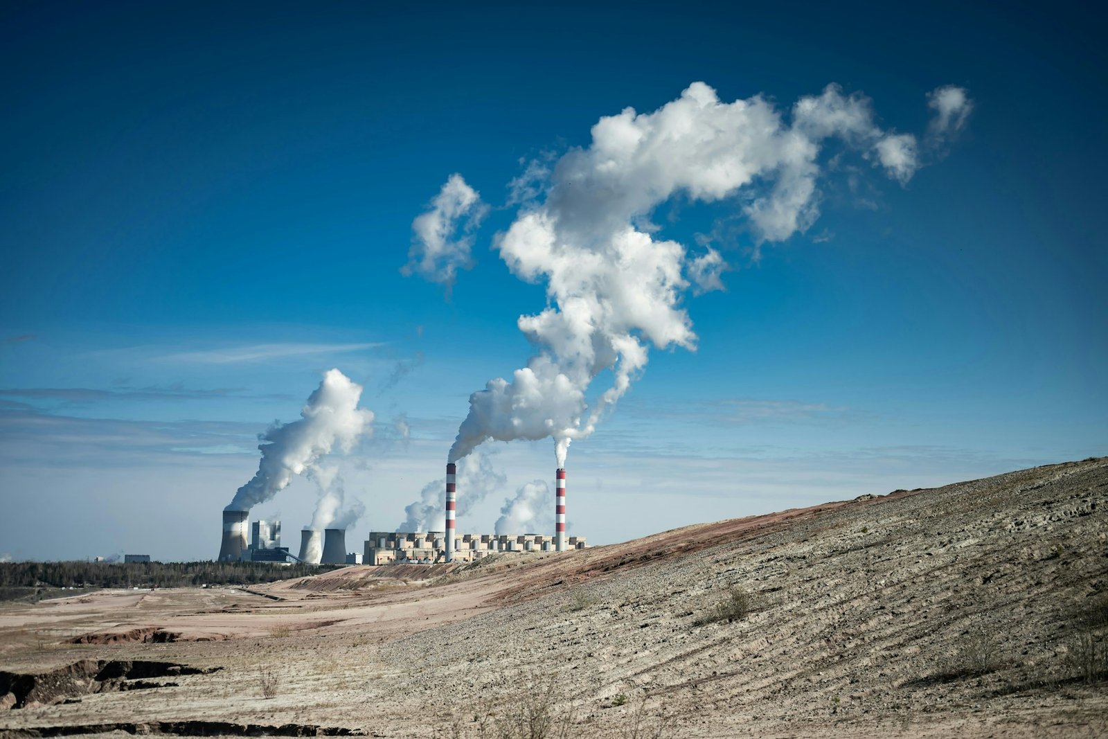 Industrial stacks and gas treatment plant against the sky